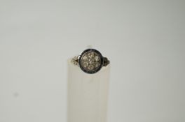 A diamond and calibre sapphire dress ring, circa 1920,