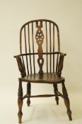 A Windsor high back armchair with elm seat