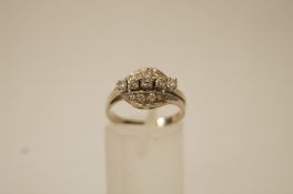 A diamond dress ring, the central line of five brilliant cuts totalling approximately 0.