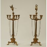 A pair of Empire style French ormolu candelabra each with five branches around a single sconce