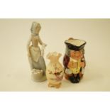 A Nao figure of a lady washing, a Royal Doulton Jolly Toby jug and a Locke and Co.