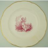 A pair of Minton porcelain plates decorated in pink enamel with putti in a landscape,