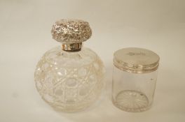 A silver topped glass toilet jar;