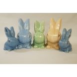 Five Sylvac models of rabbits, three in blue, one in beige and one in green, impressed,