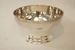 A silver bowl, makers mark obscured, London 1906, of plain form, 6.5 cm high, 11.