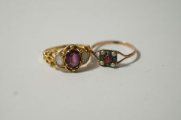 A garnet and opal dress ring;