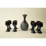 A blue glaze Rye pottery decanter and stopper together with six matching goblets