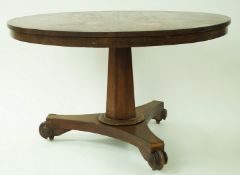 A William IV rosewood round tilt top breakfast table, on tapering hexagonal pedestal,