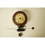 An unusually small postman's alarm clock, with mahogany case, enclosing a 6" painted face,