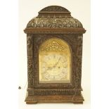 A Victorian oak cased mantel clock with brass arched dial, signed Miller Edinburgh,