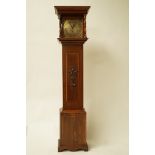 A 20th century mahogany longcase clock with brass square dial, enclosing a chiming mechanism,