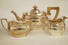 A matched three piece silver tea service, London 1930 and 1934,