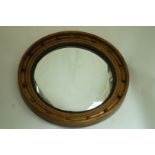 A circular Regency style convex mirror with gilt frame,