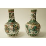 A pair of 20th century Chinese porcelain vases painted with figures in famille verte palette,