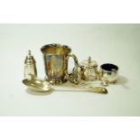 A silver mug by Edward Viner, Sheffield 1928; a three piece silver cruet set, Birmingham 1948,