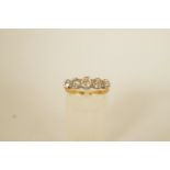 A five stone diamond ring, stamped '18ct' and 'Plat',