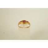 An 18ct gold stone set ring, Chester 1916, finger size O,