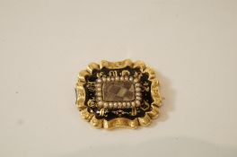 A Victorian mourning brooch, of rectangular shaped outline,