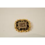 A Victorian mourning brooch, of rectangular shaped outline,