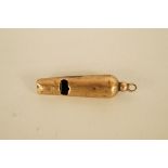 A small 9ct gold whistle, Chester 1898, 3.7cm long, 1.