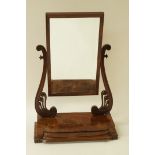 A large Victorian mahogany swing mirror, above a single drawer, 90cm high,