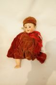 A 20th century German bisque headed doll, stamped 169 O Germany,
