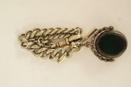 A metal watch chain with a swivel seal fob