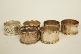 A pair of silver napkin rings; with four other silver napkin rings; 115 g (3.