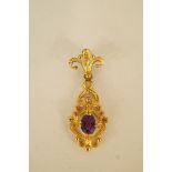 An amethyst 9ct gold pendant, 1974, of scroll design, 4cm long, 3.