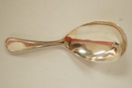 A silver caddy spoon, by James W. Potter & Sons, London, bead pattern, 9.5cm long, 18.