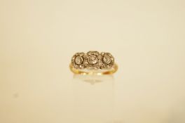 A diamond triple cluster ring, stamped '18ct', the three graduated old brilliant cuts,