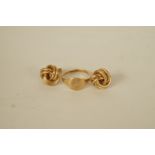 A 9ct gold signet ring; with a pair of 9ct gold knot ear studs; 3.