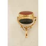 A  9ct gold swivel seal fob, with three agate faces,