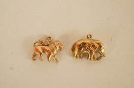 A 9ct gold lion charm; with a 9ct gold elephant charm; 3.