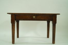 An early 20th century oak occasional table with a single drawer and brass handles, 50cm high,