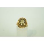 A smokey quartz 9ct gold dress ring, finger size M, 4.