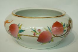 A late 20th century Chinese bowl, decorated with fruiting branches and bats,