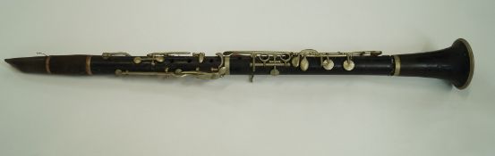 A rosewood four piece clarinet,