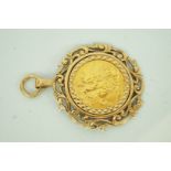 An Elizabeth II gold sovereign 1968, in a 9 carat gold fancy pendant mount, 14.