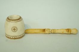 A 19th century ivory apple corer,