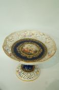 An early 19th century Vienna style comport with a pierced rim & flared base,