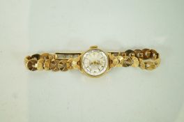 A 9ct gold Rotary ladies wrist watch, the round dial with gilt batons and hands,