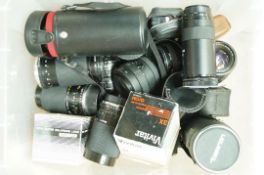 A large quantity of camera lenses to include a Hoya super enlarging lens in original box,