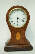An Edwardian mahogany cased mantel timepiece with marquetry inlay, 22.