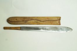A mid 20th century machete in a hide scabbard,