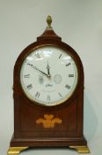 A modern mahogany cased mantel clock, with an inlaid Prince of Wales coat of arms,