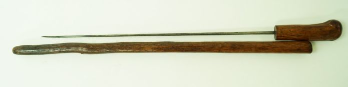 A yew wood sword stick with engraved blade,