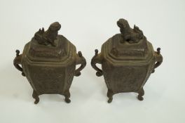 A pair of bronze vases with the Dog of Fo finials,