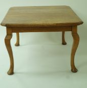 An early 20th century dining table with one loose leaf on cabriole legs, 72cm high, 106cm wide,