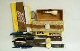 A small collection of pens including The Golden Platinum Burnham, along with various watches,